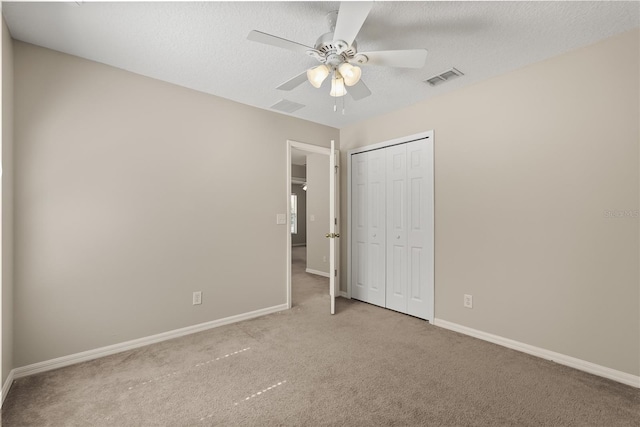 1227 Juniper Hammock St, Winter Garden, FL 34787 - unfurnished bedroom with baseboards, a closet, carpet floors, and a textured ceiling