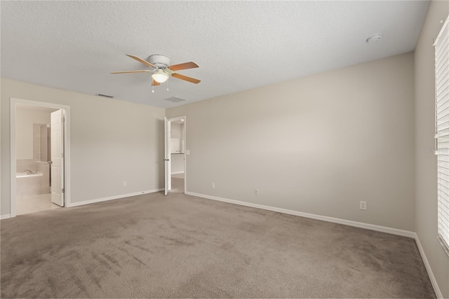 1227 Juniper Hammock St, Winter Garden, FL 34787 - unfurnished bedroom featuring carpet flooring, baseboards, a walk in closet, and a textured ceiling