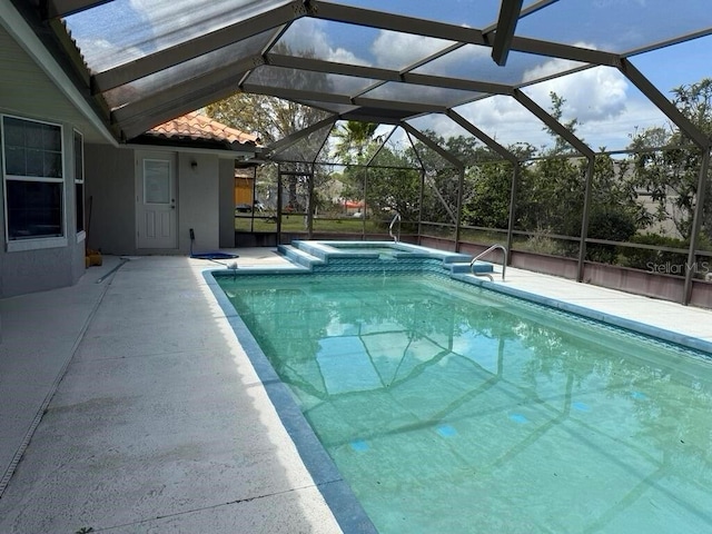 2 Bickshire Ln, Palm Coast, FL 32137 - view of swimming pool with a patio and a pool with connected hot tub