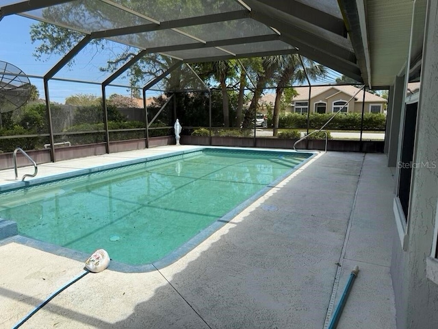 2 Bickshire Ln, Palm Coast, FL 32137 - view of swimming pool featuring a patio and a lanai