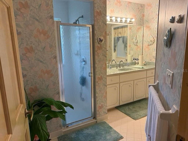 2 Bickshire Ln, Palm Coast, FL 32137 - full bath featuring wallpapered walls, a stall shower, tile patterned flooring, and vanity