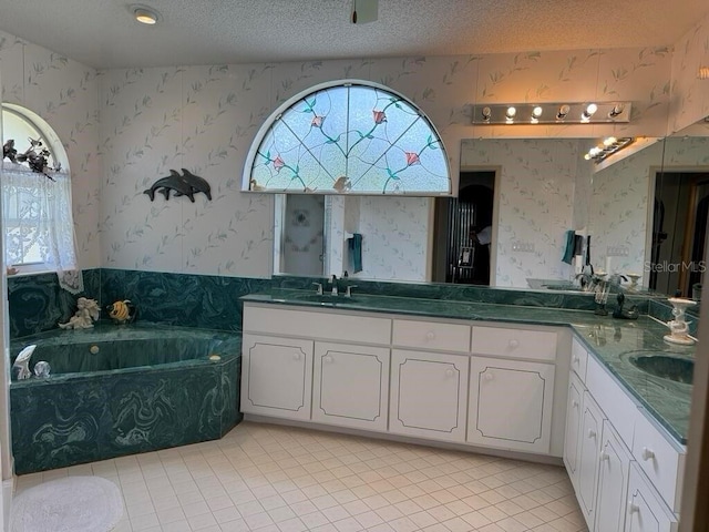 2 Bickshire Ln, Palm Coast, FL 32137 - bathroom with wallpapered walls, tile patterned flooring, healthy amount of natural light, a bath, and double vanity