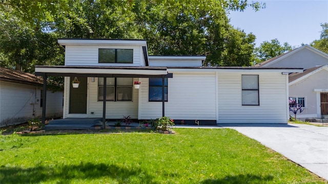 415 S Lancelot Ave, Orlando, FL 32835 - contemporary home featuring a front yard, a porch, and driveway