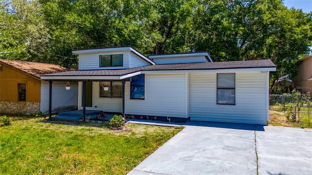 415 S Lancelot Ave, Orlando, FL 32835 - view of front of property with covered porch, a shingled roof, and driveway