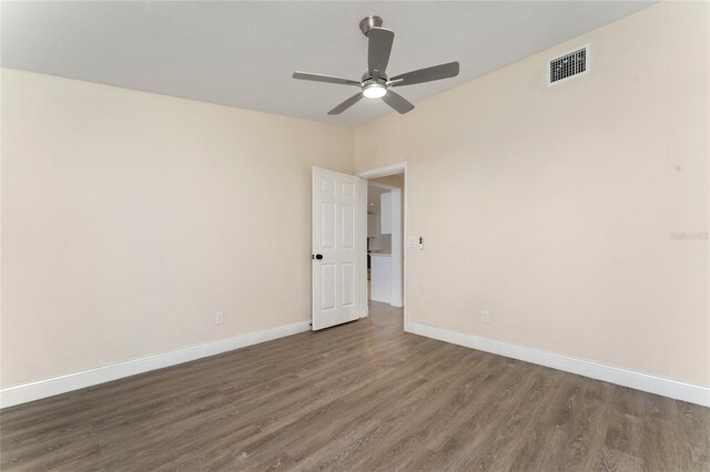 415 S Lancelot Ave, Orlando, FL 32835 - empty room with wood finished floors, a ceiling fan, and baseboards