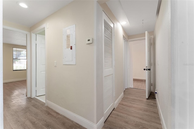 415 S Lancelot Ave, Orlando, FL 32835 - corridor with wood finished floors, baseboards, and electric panel