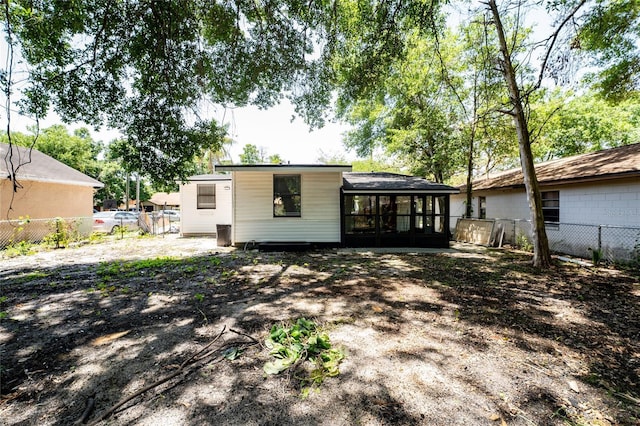 415 S Lancelot Ave, Orlando, FL 32835 - back of house featuring a sunroom and a fenced backyard