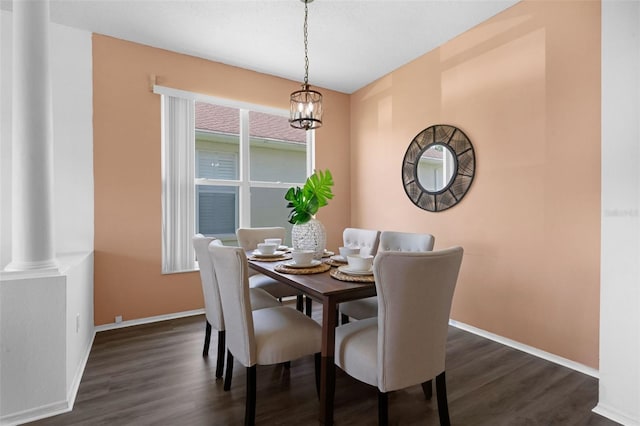 468 Jaybee Ave, Davenport, FL 33897 - dining area with dark wood-style flooring, baseboards, and a chandelier