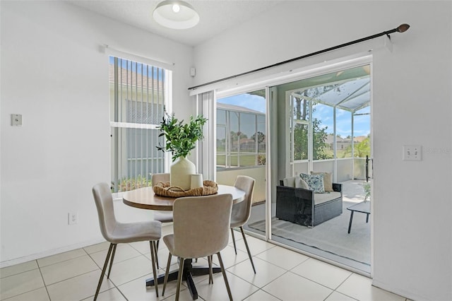 468 Jaybee Ave, Davenport, FL 33897 - dining area with light tile patterned flooring and baseboards