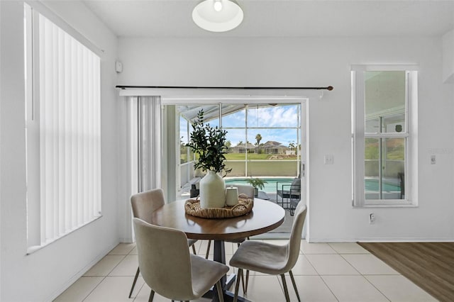 468 Jaybee Ave, Davenport, FL 33897 - dining room with light tile patterned floors and baseboards