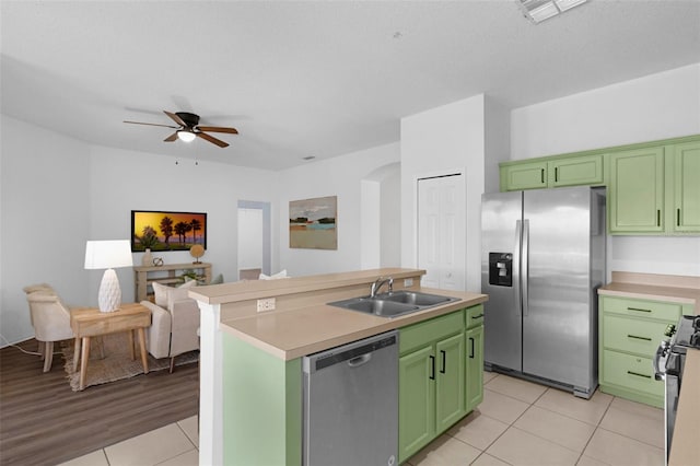 468 Jaybee Ave, Davenport, FL 33897 - kitchen featuring green cabinets, appliances with stainless steel finishes, a sink, and ceiling fan