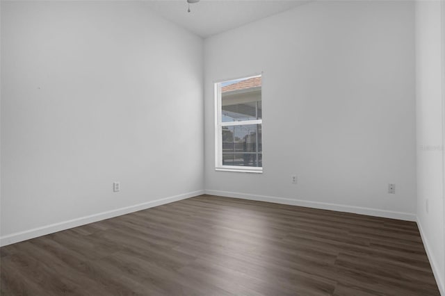 468 Jaybee Ave, Davenport, FL 33897 - spare room featuring ceiling fan, dark wood finished floors, and baseboards