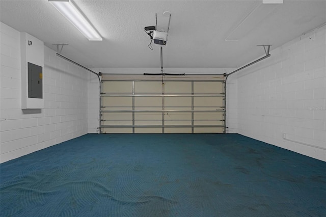 468 Jaybee Ave, Davenport, FL 33897 - garage featuring electric panel, a garage door opener, and concrete block wall
