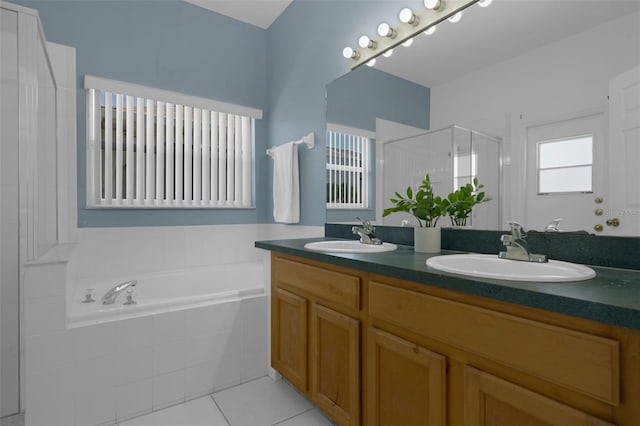 468 Jaybee Ave, Davenport, FL 33897 - full bath with a stall shower, double vanity, a bath, and tile patterned flooring