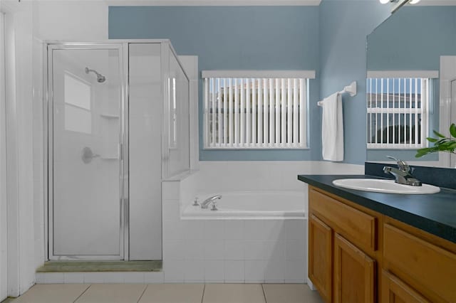 468 Jaybee Ave, Davenport, FL 33897 - bathroom featuring a stall shower, vanity, a garden tub, and tile patterned flooring