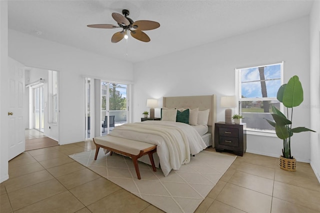 468 Jaybee Ave, Davenport, FL 33897 - bedroom featuring access to outside, light tile patterned flooring, ceiling fan, and baseboards
