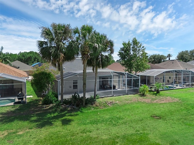 468 Jaybee Ave, Davenport, FL 33897 - back of property with a lawn and a lanai