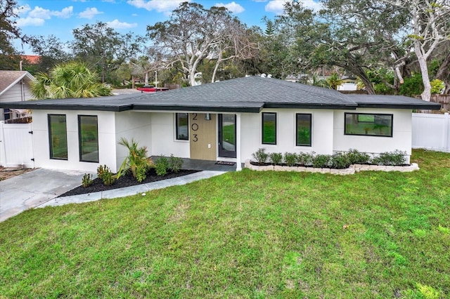 203 Driftwood Dr W, Palm Harbor, FL 34683 - view of front of home with roof with shingles and stucco siding