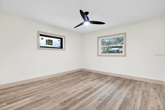 203 Driftwood Dr W, Palm Harbor, FL 34683 - spare room with light wood finished floors, baseboards, and ceiling fan