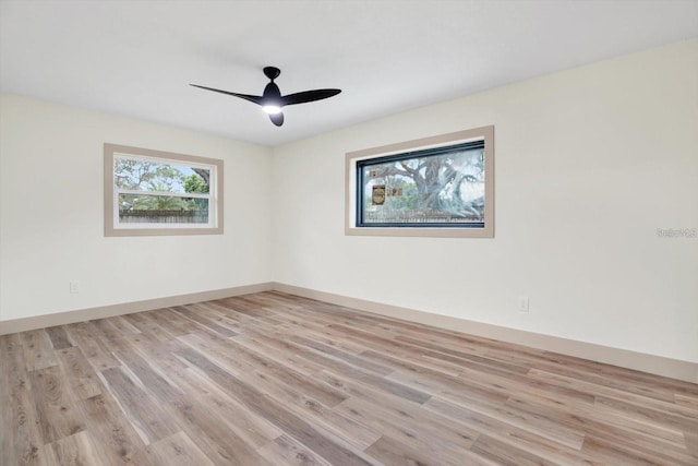 203 Driftwood Dr W, Palm Harbor, FL 34683 - spare room with light wood-style floors, ceiling fan, and baseboards