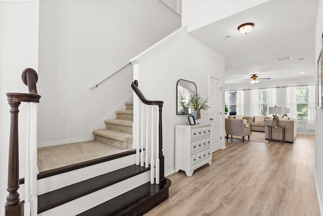 3868 Whitewood Ct, Oviedo, FL 32766 - stairway with ceiling fan, wood finished floors, and baseboards