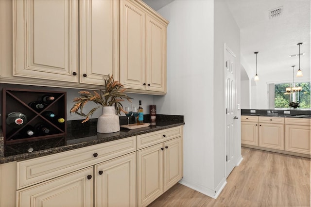 3868 Whitewood Ct, Oviedo, FL 32766 - bar featuring light wood-type flooring, baseboards, pendant lighting, and a chandelier