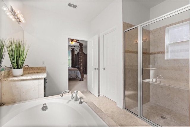 3868 Whitewood Ct, Oviedo, FL 32766 - ensuite bathroom featuring a bath, a stall shower, a ceiling fan, and vanity