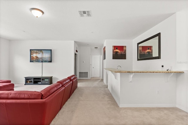 3868 Whitewood Ct, Oviedo, FL 32766 - living area with light carpet, wet bar, and baseboards