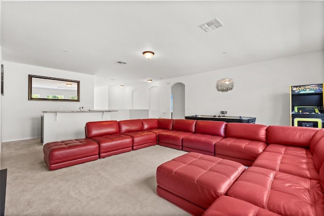3868 Whitewood Ct, Oviedo, FL 32766 - carpeted living room featuring arched walkways
