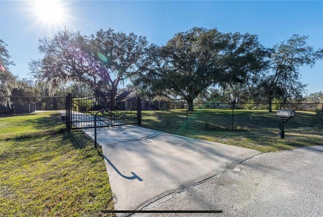 6917 Roman Ct, Clermont, FL 34714 - view of home's community with a gate