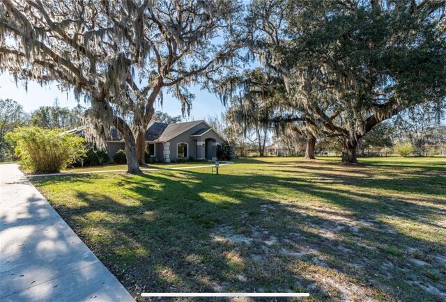 6917 Roman Ct, Clermont, FL 34714 - view of front of home featuring a front yard