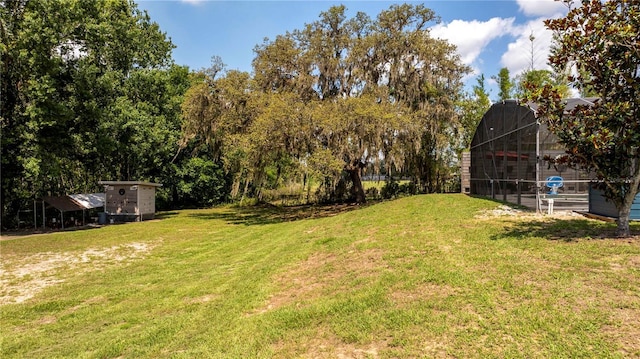 6917 Roman Ct, Clermont, FL 34714 - view of grassy yard featuring a lanai