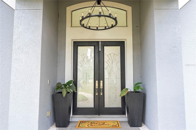 6917 Roman Ct, Clermont, FL 34714 - doorway to property featuring french doors and stucco siding