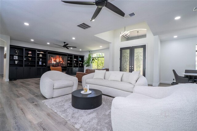6917 Roman Ct, Clermont, FL 34714 - living room with a ceiling fan, wood finished floors, recessed lighting, and baseboards