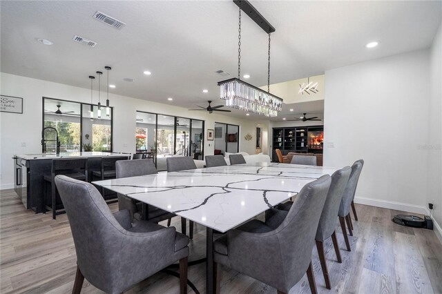 6917 Roman Ct, Clermont, FL 34714 - dining area featuring a ceiling fan, baseboards, light wood-type flooring, and recessed lighting