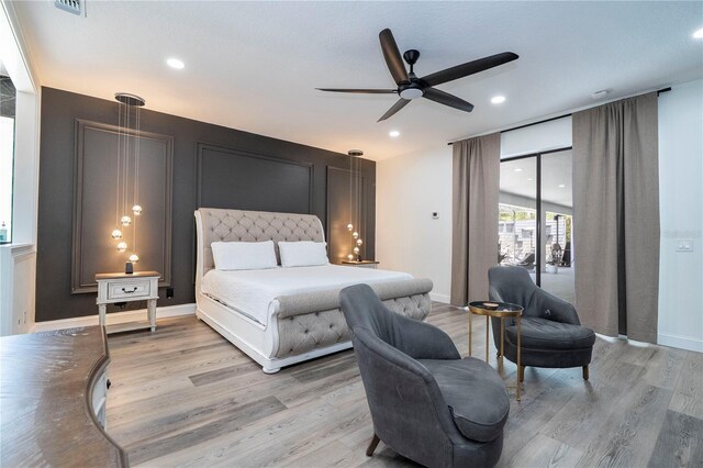 6917 Roman Ct, Clermont, FL 34714 - bedroom featuring light wood-type flooring, recessed lighting, ceiling fan, baseboards, and access to exterior