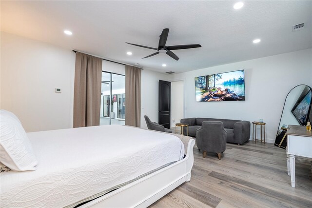 6917 Roman Ct, Clermont, FL 34714 - bedroom with light wood-style flooring, recessed lighting, and a ceiling fan