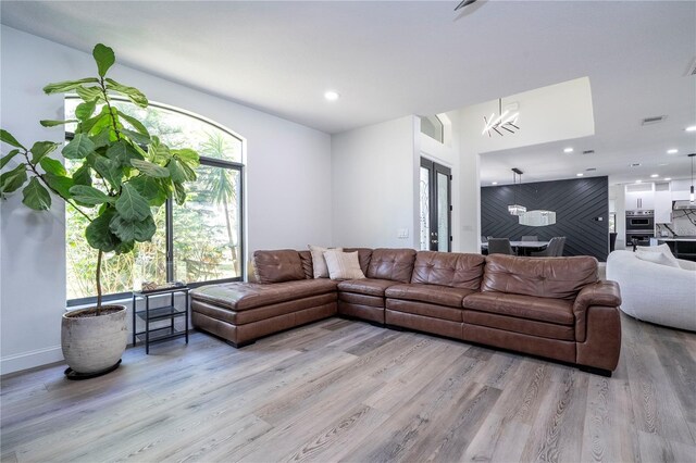 6917 Roman Ct, Clermont, FL 34714 - living room with wood finished floors, recessed lighting, baseboards, and a chandelier