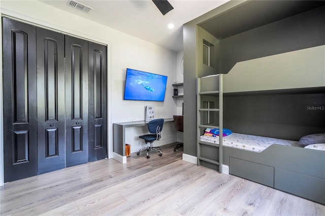 6917 Roman Ct, Clermont, FL 34714 - bedroom featuring wood finished floors, baseboards, an office area, a closet, and ceiling fan