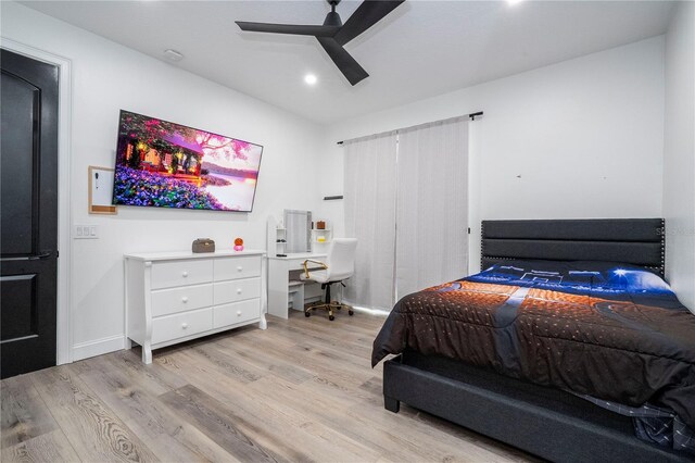 6917 Roman Ct, Clermont, FL 34714 - bedroom featuring wood finished floors, an office area, a ceiling fan, recessed lighting, and baseboards