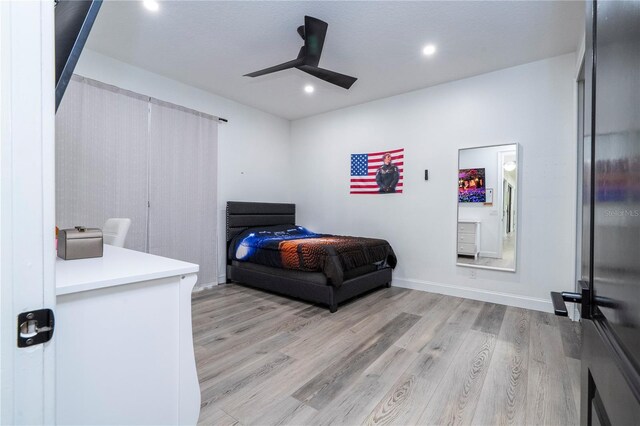 6917 Roman Ct, Clermont, FL 34714 - bedroom featuring light wood-style floors, recessed lighting, and ceiling fan