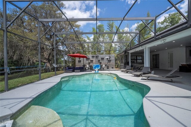 6917 Roman Ct, Clermont, FL 34714 - outdoor pool with a patio, outdoor lounge area, and glass enclosure