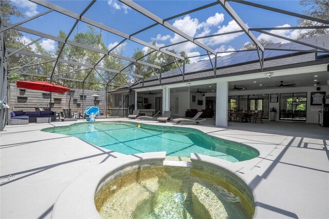 6917 Roman Ct, Clermont, FL 34714 - view of swimming pool with a ceiling fan, a pool with connected hot tub, an outdoor hangout area, and a patio area