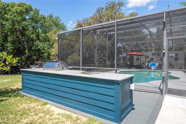 6917 Roman Ct, Clermont, FL 34714 - outdoor pool featuring area for grilling and glass enclosure