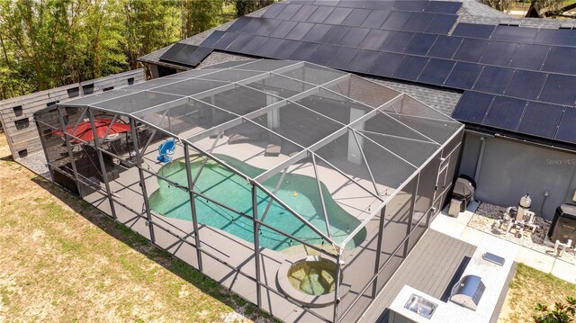 6917 Roman Ct, Clermont, FL 34714 - swimming pool with glass enclosure and a patio area