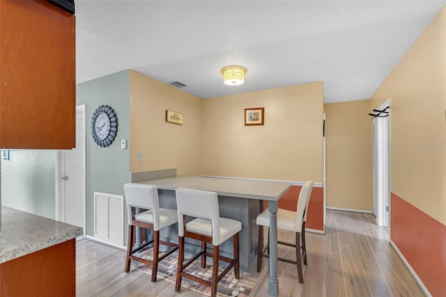 7500 NW 66th Ter, Tamarac, FL 33321 - dining area with light wood-style flooring and baseboards