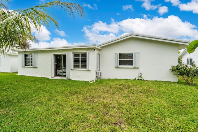 7500 NW 66th Ter, Tamarac, FL 33321 - back of property with stucco siding and a yard