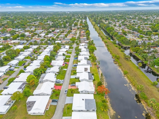7500 NW 66th Ter, Tamarac, FL 33321 - aerial perspective of suburban area featuring a nearby body of water