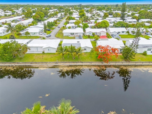 7500 NW 66th Ter, Tamarac, FL 33321 - aerial perspective of suburban area with a large body of water