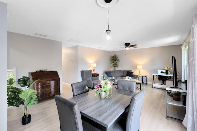 117 Georgetown Dr Unit C, Casselberry, FL 32707 - dining room featuring light wood-style flooring, a ceiling fan, and baseboards